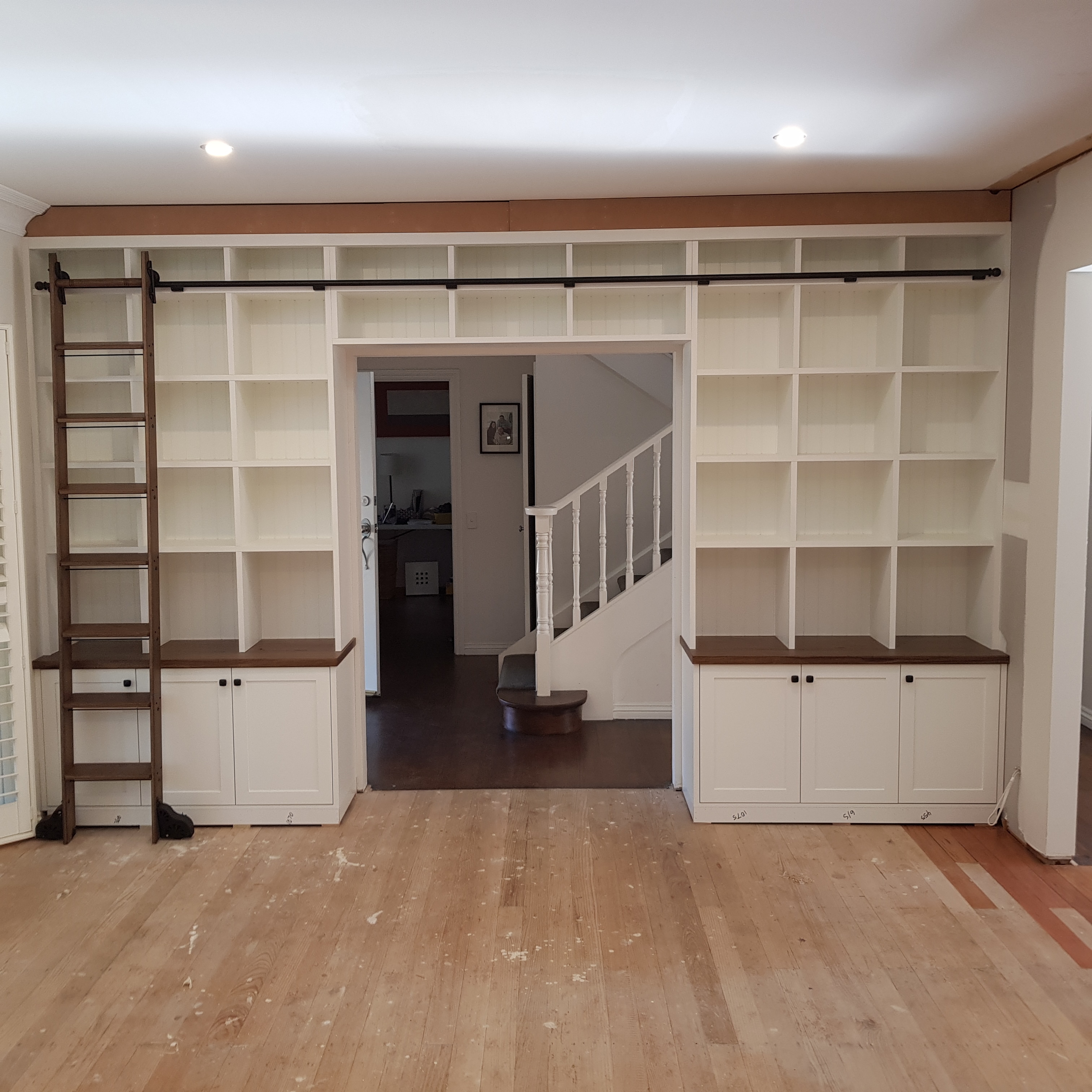 bookshelves-ladder-on-rail